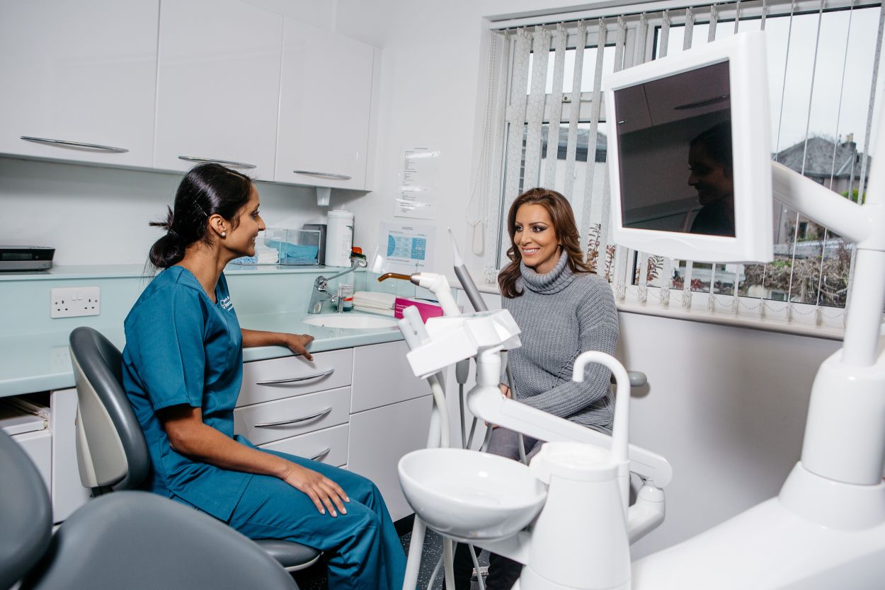 dentist and patient smiling