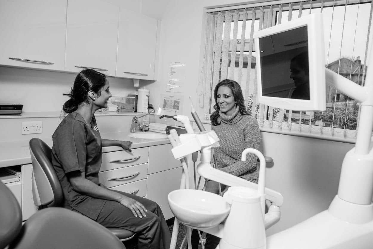 dentist and patient smiling